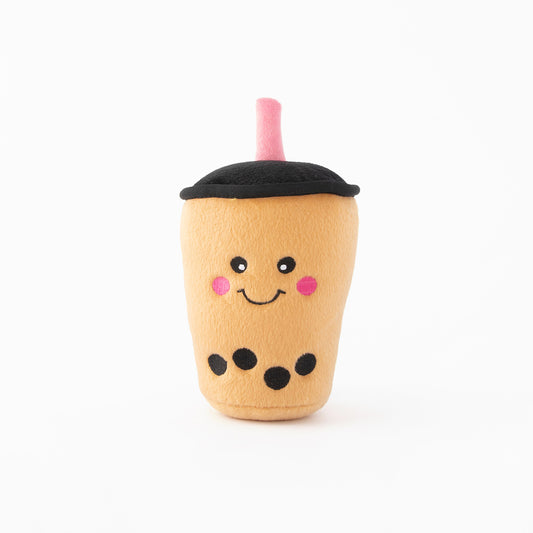 A picture of a boba milk tea plush toy with a white background.